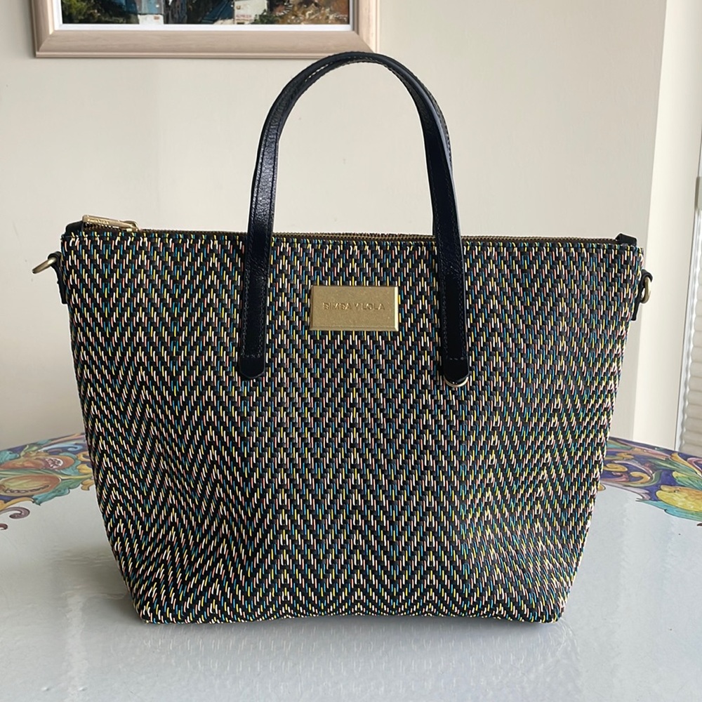 Brand new, beautiful bag. Never used. Can be used with shoulder strap.